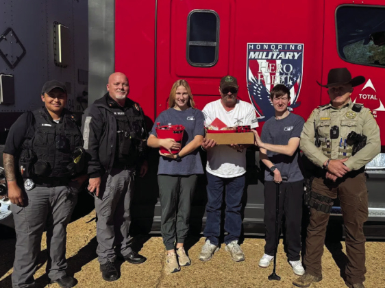 Fort Jesup CAR members, Allie and Nicholas, give Mr. David, the driver, a Thank You for donating his time and truck to deliver the wreaths to Sabine Parish.