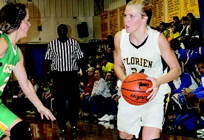 Florien junior Cheyenne Herrington (24) attempts to drive to the lane in the Lady Blackcats’ hard-fought win last Friday over Castor in the first round of the Pleasant Hill Tournament.