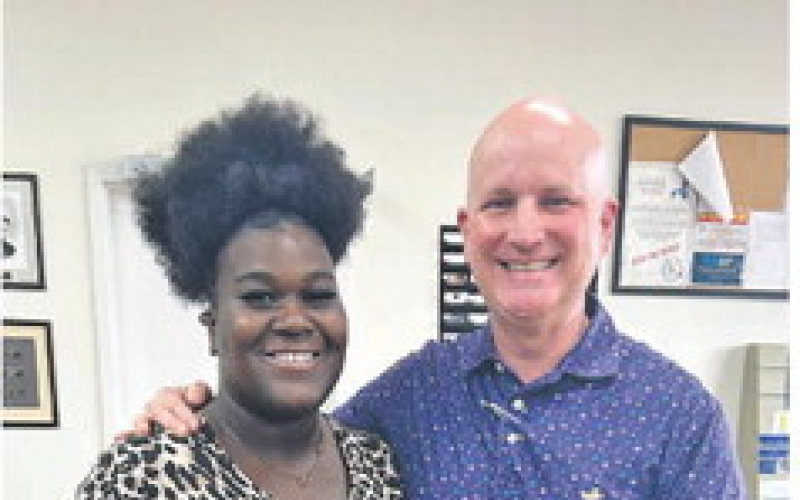 Pictured from left are La’Miracle Harrington and Many Mayor Robert Hable.