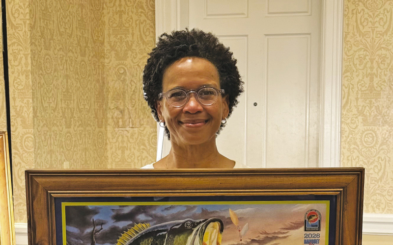 Georgia Craven of Many was the successful bidder on the first signed and numbered print by Artist Larry Riales.