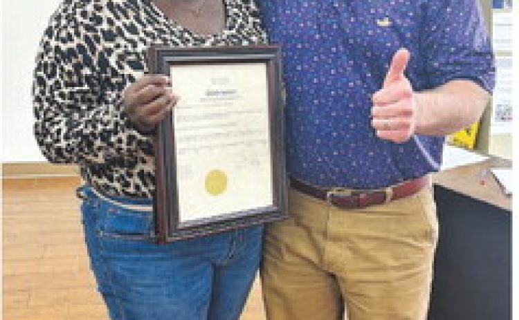 Pictured from left are La’Miracle Harrington and Many Mayor Robert Hable.