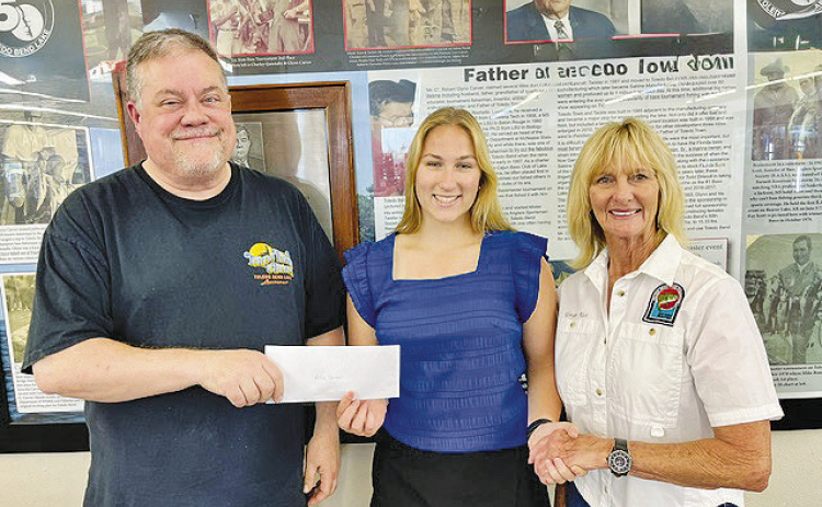 The Toledo Bend Lake Association awards the Glynn Carver Memorial Scholarship for $5,000 to Allie Tarver of Florien High School. Pictured from the left are Curt Carver, scholarship recipient Allie Tarver, and TBLA President Ginger Rice.