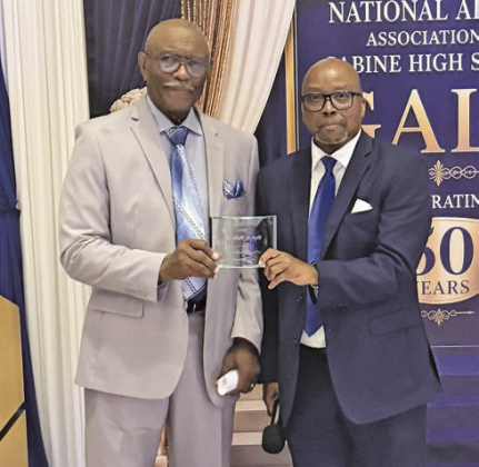 Keynote speaker Herbert Wolfe is pictured receiving an honor for his part in the festivities.