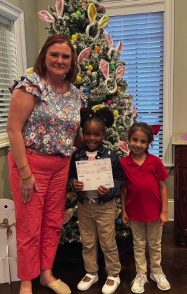 BOM’s Kim Wilkerson presented a check to Saphe Jackson and Scarlett Remedies for the Many Sweetees Rookies.