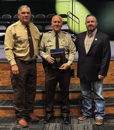Eddie Jones, Jr., center, recently graduated from Class 58 of the Caddo Sheriff’s Regional Training Academy