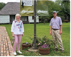 Amanda and Dean Lambert of Many are shown on the grounds of the Louisiana Orphan Train Museum during the spring.