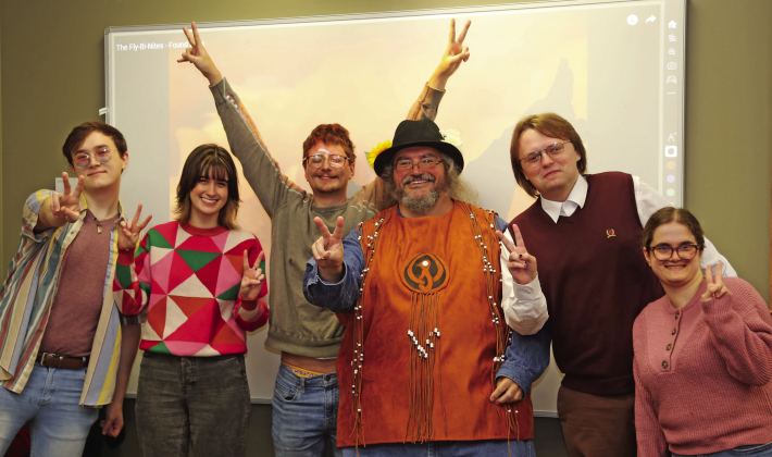 To give his students a taste of hippie counterculture, Dr. Charles Pellegrin worked with costume designer Elizabeth Lofton to recreate a vest worn by musician Terry Kirkman on the Ed Sullivan Show in 1969. From left are Cameron Remry, Katie Grace Rian, Ma