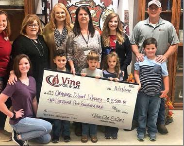 Vine Oil donates to Converse High School Library
