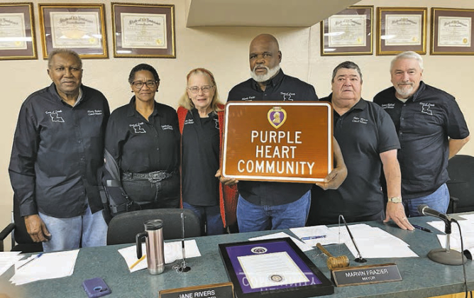 Many locals were on hand for the signing of the proclamation. Pictured at center is Mayor Marvin Frazier, who is flanked by town council members Harry Babers, Sandra Newton, Jane Rivers, Allen Rivers, and James Hubbard.