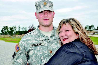 Proud mother, Tina McCormic of Many, congratulates her son after he was promoted to Major Timothy Adam McCormic in ceremonies at Camp Shelby, Miss. on Oct. 26.