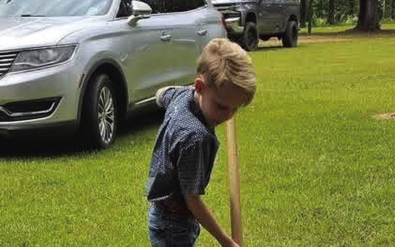 Rhett Ammons collects soil to be used in the construction of the Gresham Prayer Chapel, currently under construction at Southern Nazarene University.
