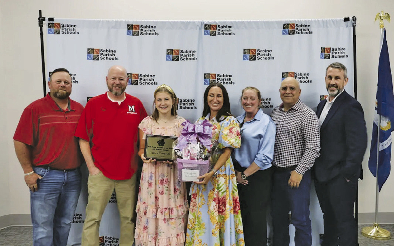 The 2026 Students of the Year were recently honored by the Sabine Parish School Board. Pictured from left are Josh Jenkins, School Board Member; Kyle Penfield, MJHS Principal; Vivian Campbell, Eighth Grade Student of the Year; Stacy Alford, Community Bank; Edie Gown, Asst Principal MJHS; Everett Guidry, School Board Member; and Shane Wright, Superintendent of Schools.