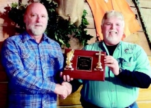 Kerney Briscoe, left, for “2014 Angler of the Year” and “Heaviest Stringer of the Year” from TBCA President David Martinez.