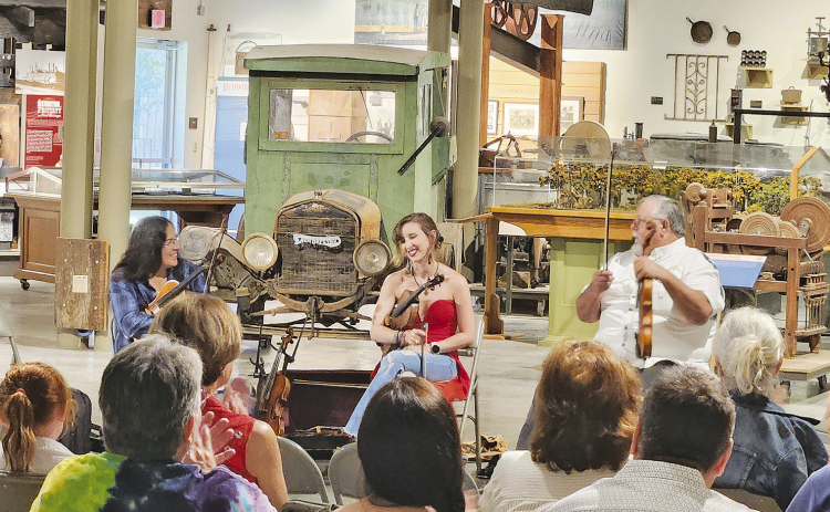 Fiddlers, from left, Gina Forsyth, Clancey Stewart and Joe Suchanek at the “Fiddlin’ with the Finest! A Celebration of Louisiana Folk Fiddling” program held Saturday at the LSU Rural Life Museum in Baton Rouge. The program was sponsored by the Louisiana Folklife Center at Northwestern State University to promote the annual Louisiana State Fiddle Championship which will be held in Natchitoches on July 18. Photo by Christina Brown.