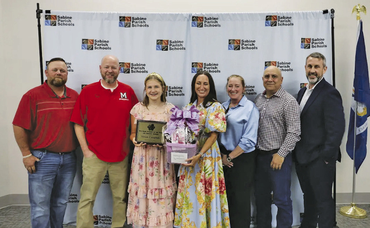 The 2026 Students of the Year were recently honored by the Sabine Parish School Board. Pictured from left are Josh Jenkins, School Board Member; Kyle Penfield, MJHS Principal; Vivian Campbell, Eighth Grade Student of the Year; Stacy Alford, Community Bank; Edie Gown, Asst Principal MJHS; Everett Guidry, School Board Member; and Shane Wright, Superintendent of Schools.