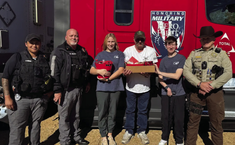 Fort Jesup CAR members, Allie and Nicholas, give Mr. David, the driver, a Thank You for donating his time and truck to deliver the wreaths to Sabine Parish.