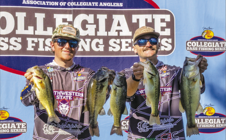 Northwestern State University Fishing Team members Ayden Slack, left, and Daniel Gallagher display their catch at the AFTCO Collegiate Bass Open on Lake Dardanelle in Russellville, Arkansas.