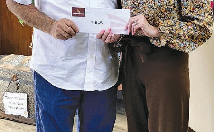 Community Bank is a Bronze Sponsor for the 2026 TBLA Bass Unlimited Banquet and Auction. Shown presenting the check to BU Chair Tommy Phillips is Vice President Stacy Alford.